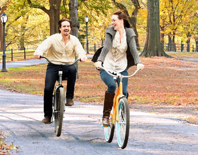 62167433e6fd9_couple_bikes_fall_690x540.webp