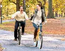62167433e6fd9_couple_bikes_fall_690x540.webp